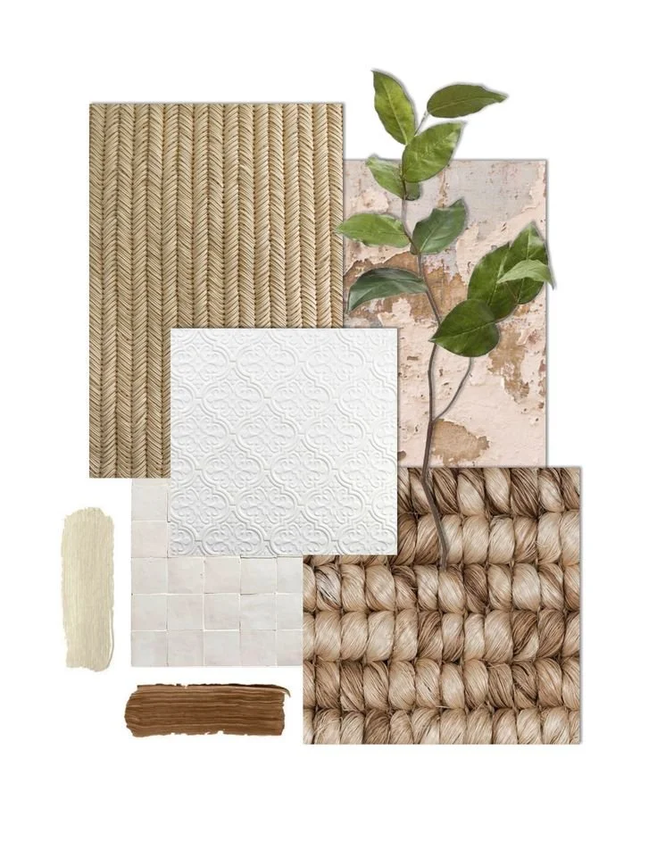 Collection of natural textures and materials including woven straw, distressed plaster, textured white tile, cream and brown fabric swatches, a small piece of beige fabric, and a sprig of green leaves.