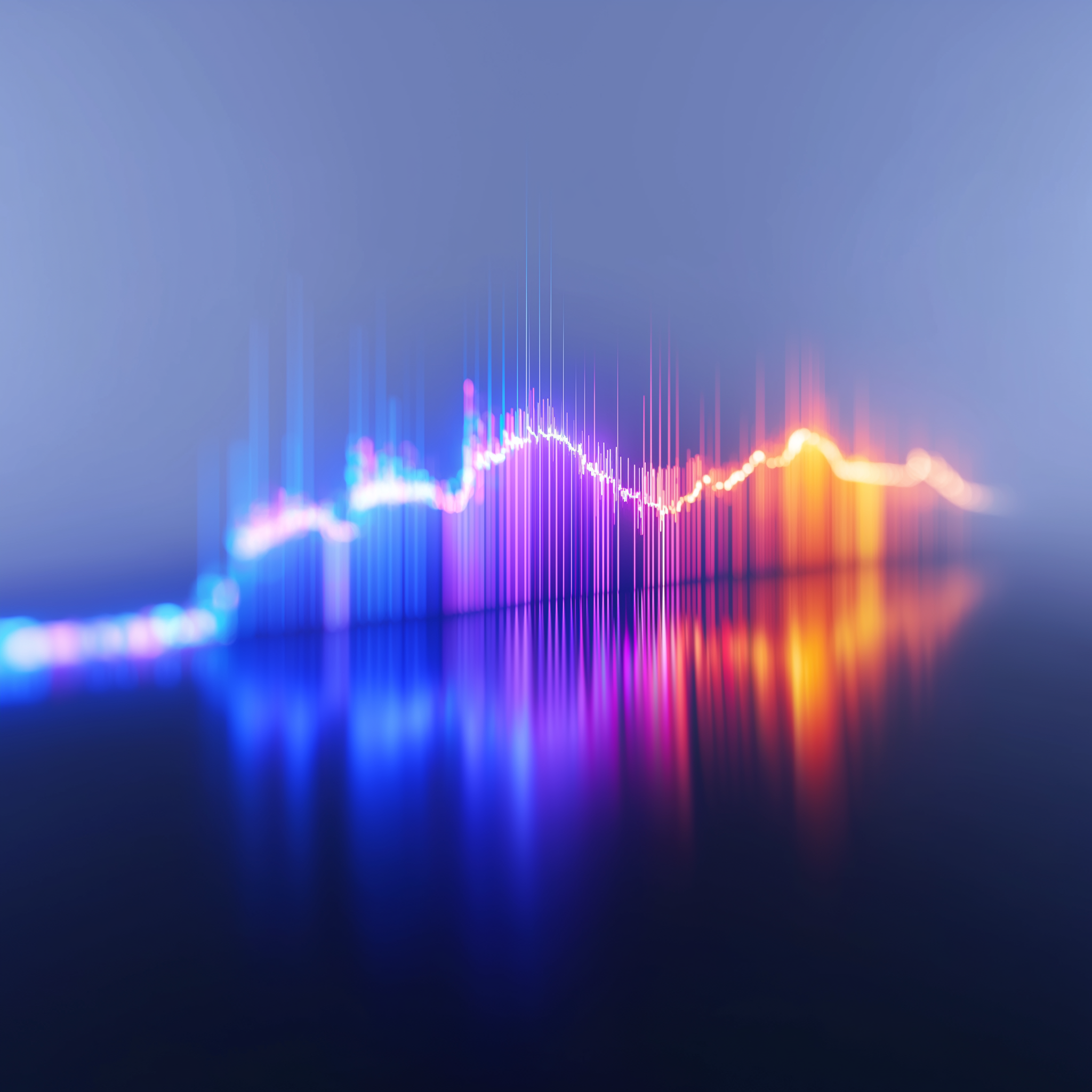 Colorful digital equalizer with reflected bars on a dark surface.