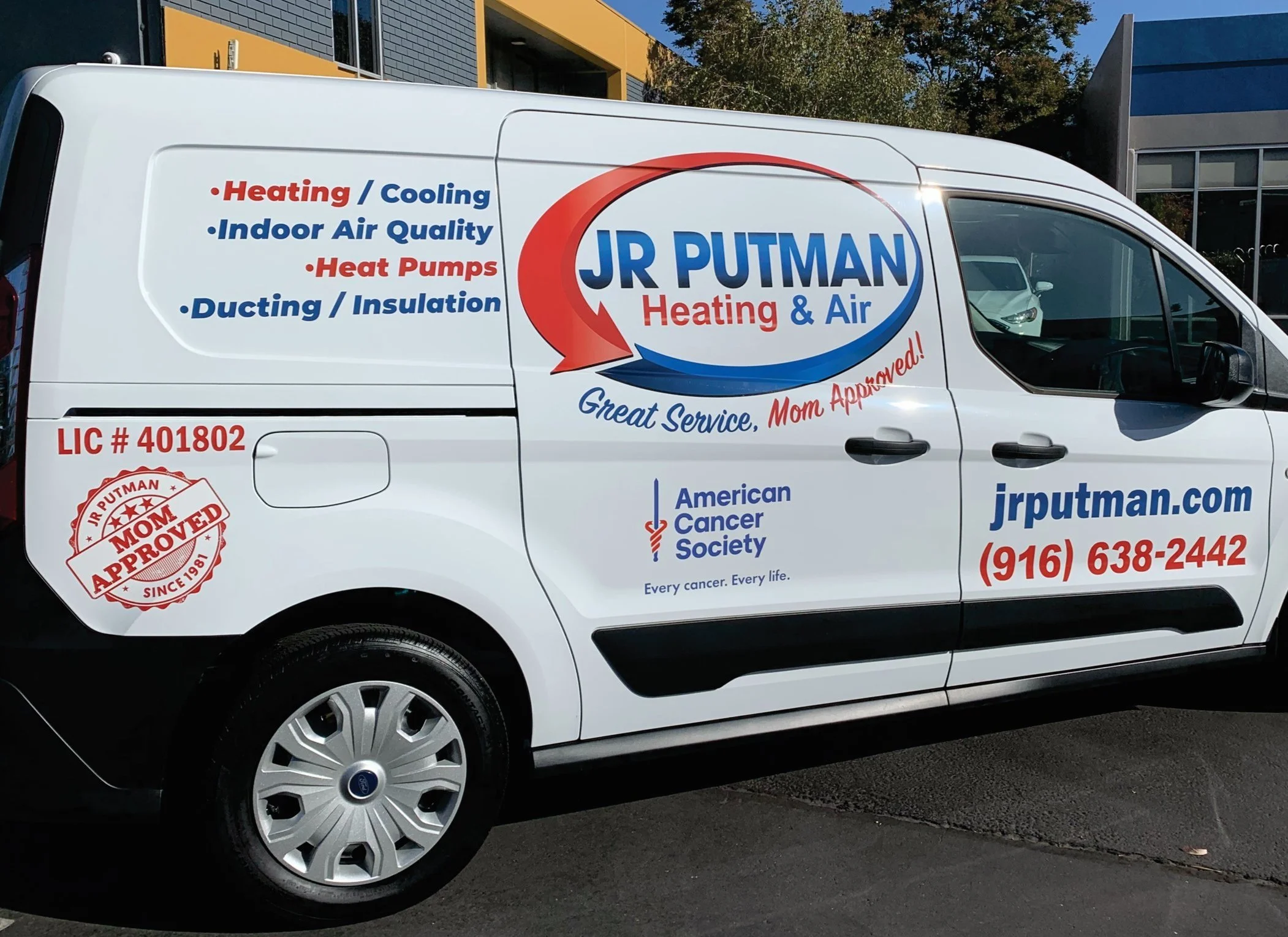 White service van with company branding for JR Putman Heating & Air, displaying services related to heating, cooling, indoor air quality, heat pumps, ducting, and insulation. The van features the company's website, phone number, license number, and a badge indicating mom approval. The van also shows the American Cancer Society logo with the tagline 'Every cancer. Every life.'