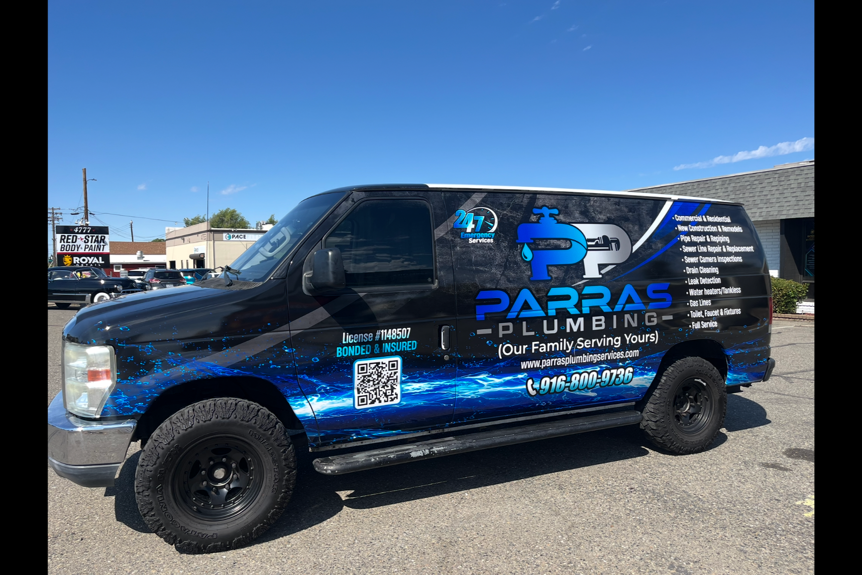 Blue commercial van with advertising for Advanced Plumbing Heating and Air, including phone number and website, parked in a lot with other cars and a building in the background.