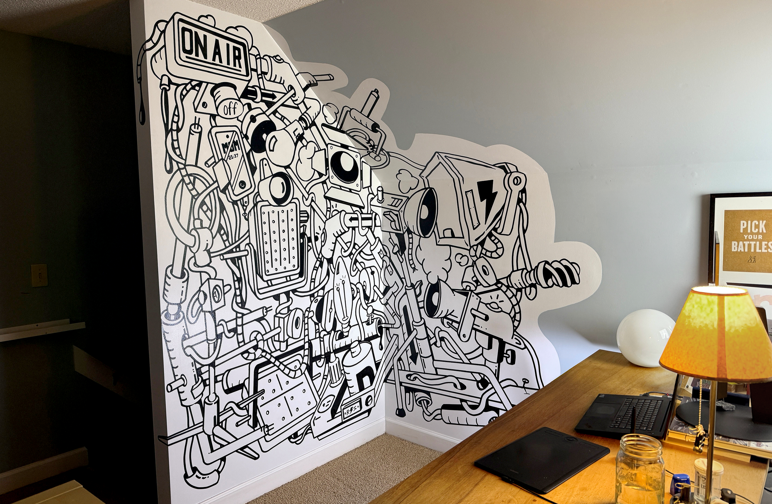 Black and white wall art featuring a detailed illustration of various electronic and mechanical components, with an 'ON AIR' sign at the top.