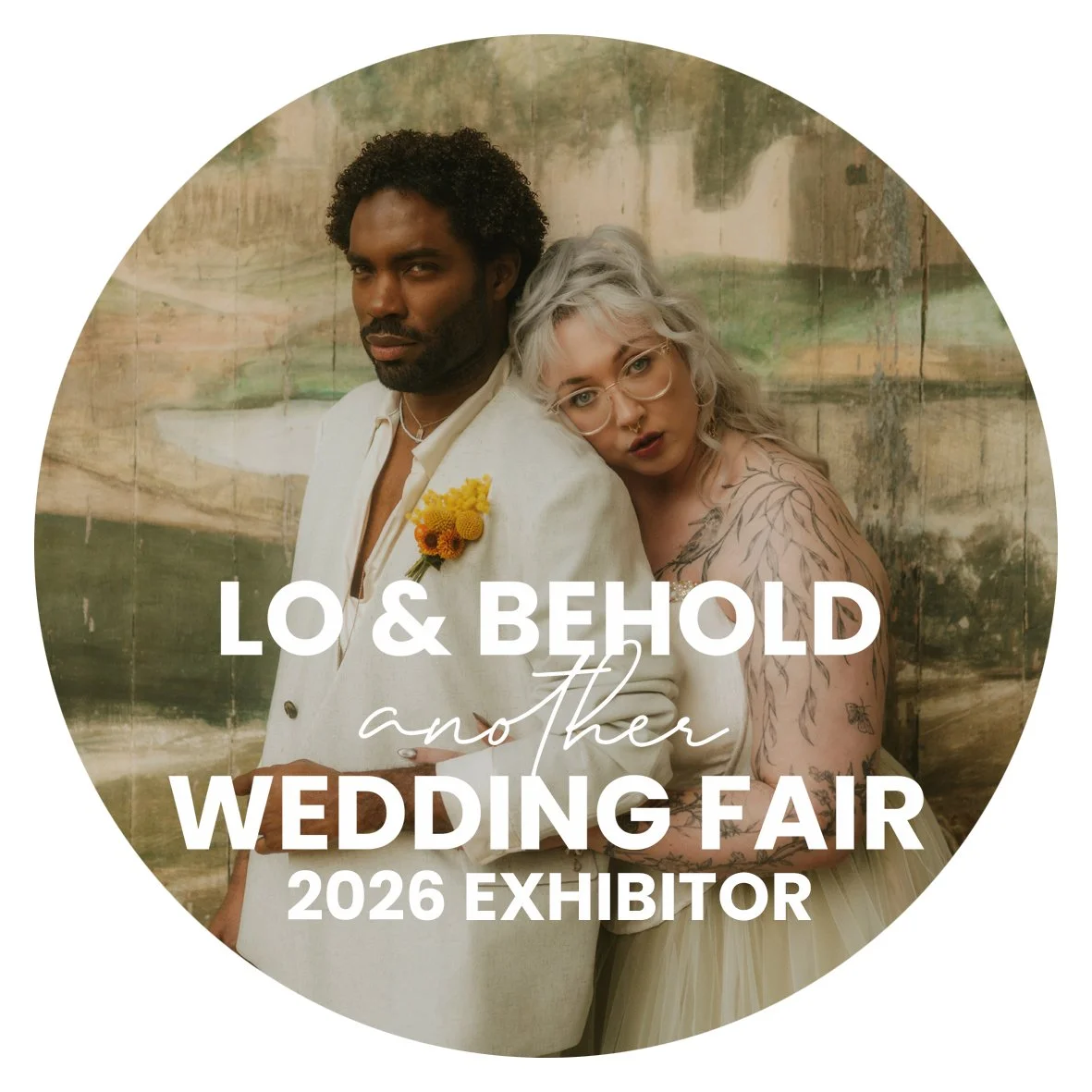 A man and woman dressed in wedding attire standing in a warmly lit indoor setting, with text overlay that reads 'LO & BEHOLD and Other Wedding Fair 2025 Exhibitor.'