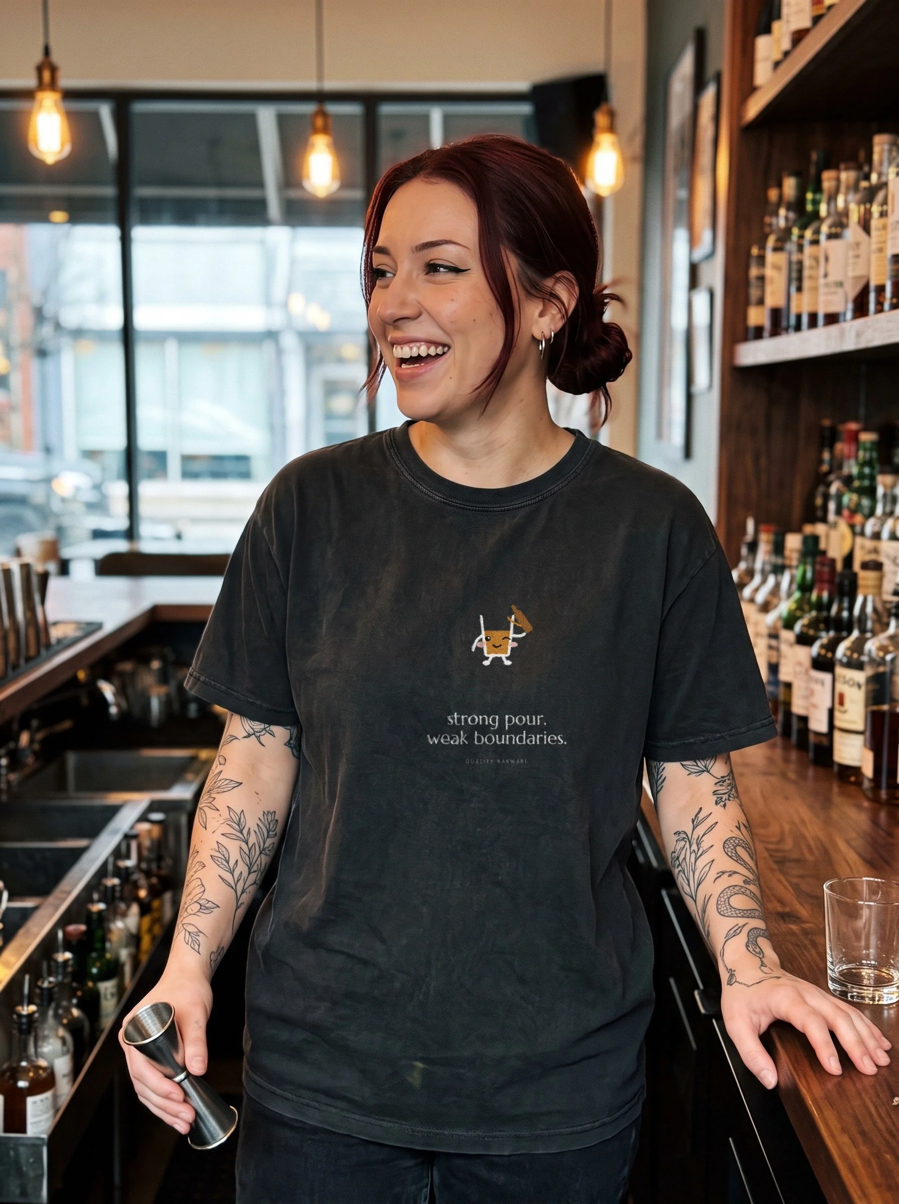 Tattooed bartender in a Pepper The Heavy Hand tee