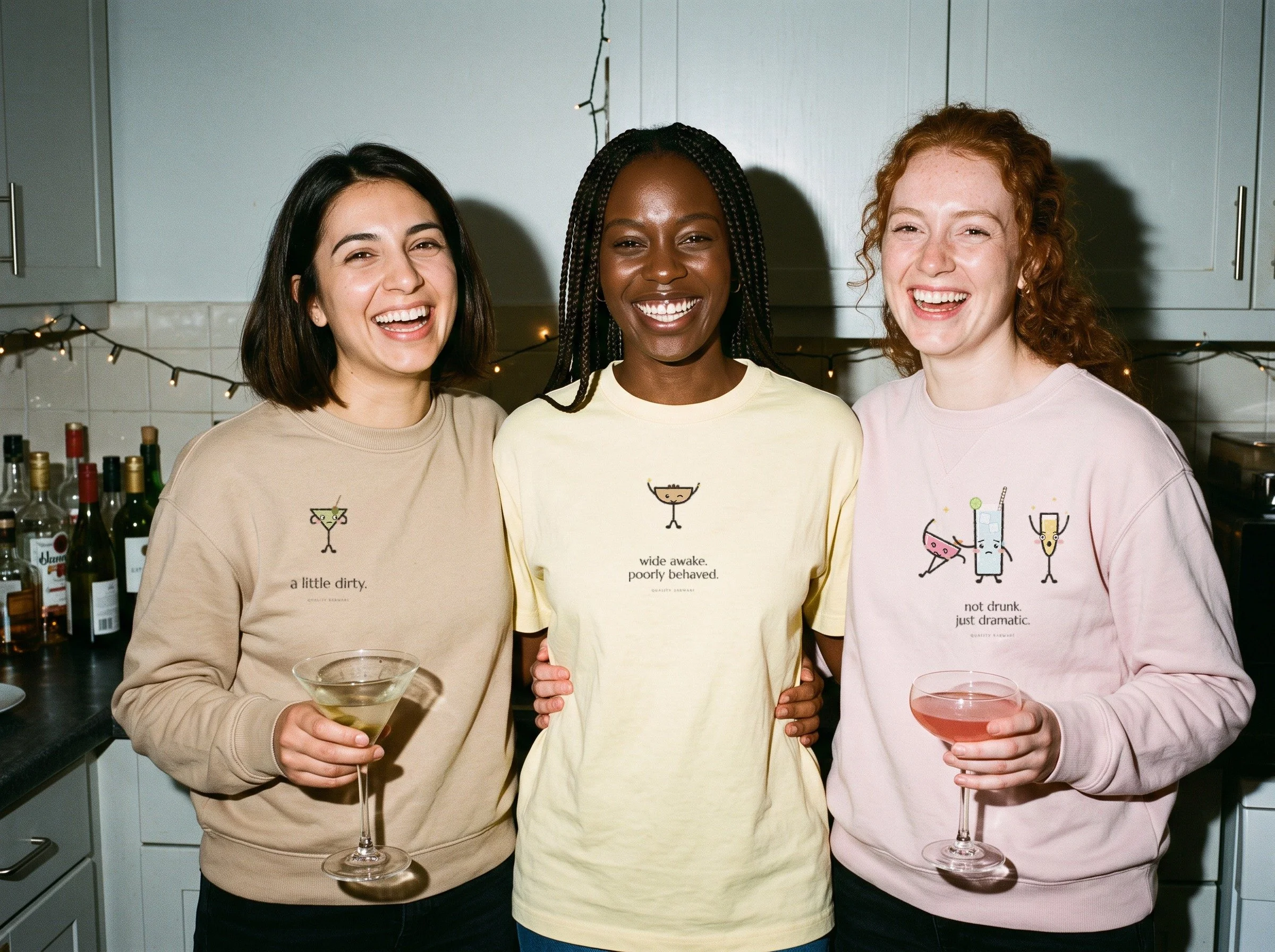 Three friends at a girls night wearing Lil Pours shirts and crewnecks