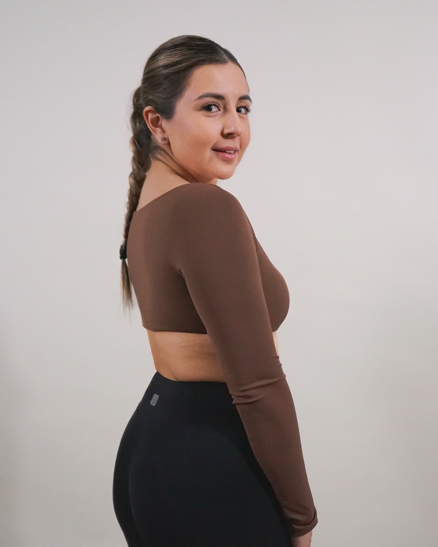 Karina is serving looks and sass in our Square Neck Long Sleeve Crop Top &mdash; chocolate brown never looked so sweet! She&rsquo;s wearing a size small, but the confidence? Extra large. (Also comes in beige if you&rsquo;re feelin&rsquo; a little van