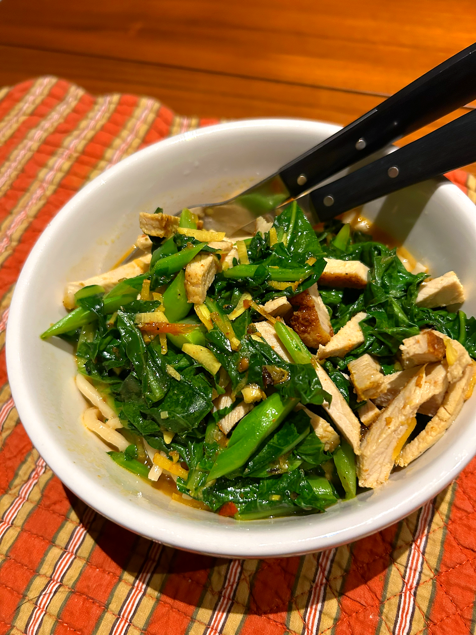 Stir-fry gai lan and roast chicken over noodles.