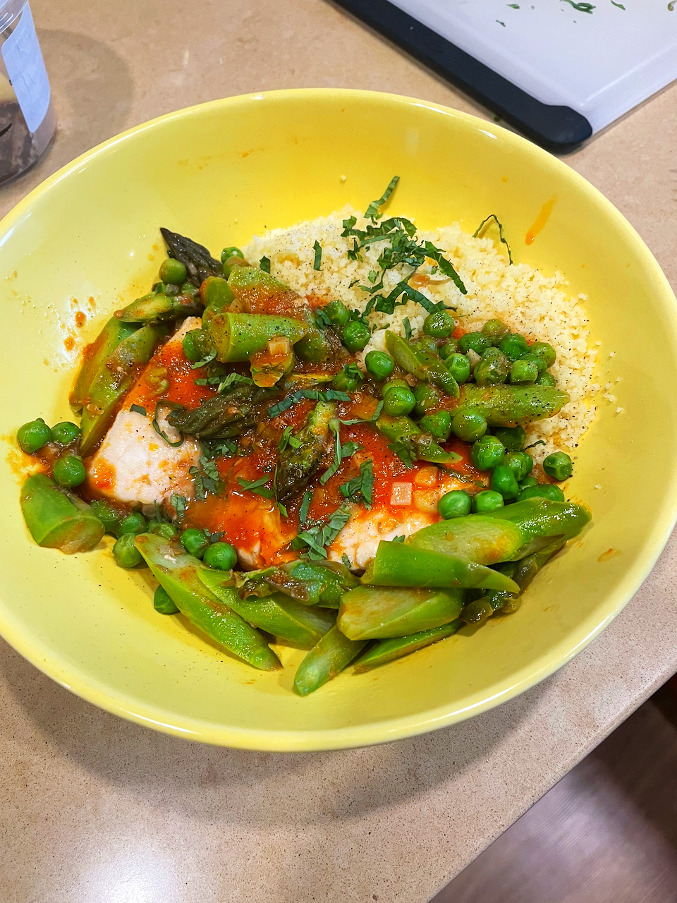 Fish. asparagus. peas. moroccan-seasoned tomato. couscous. mint.