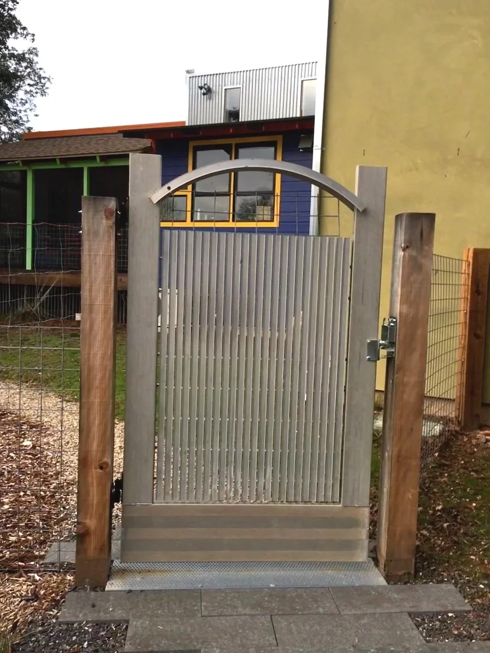 Garden gate, designed from various reclaimed aluminum pieces, assembled by metalworker in Ukiah...