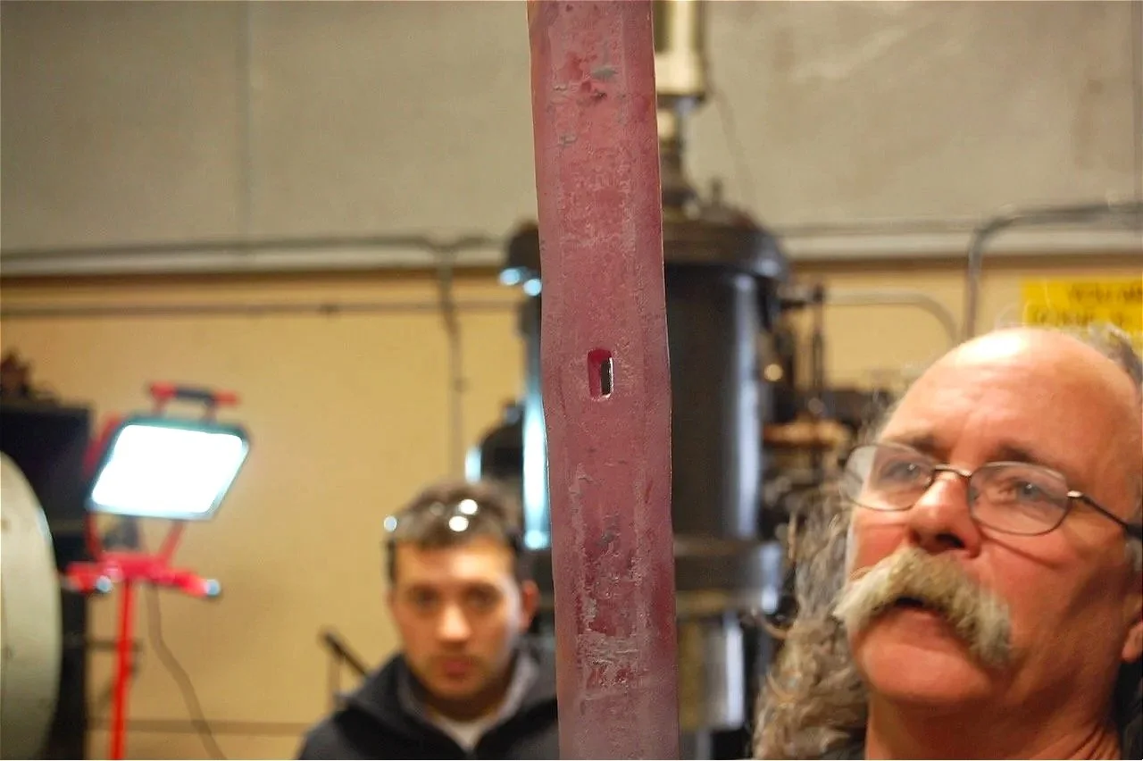 The duller red glow, not less impressive, as Tim and assistant check their work...