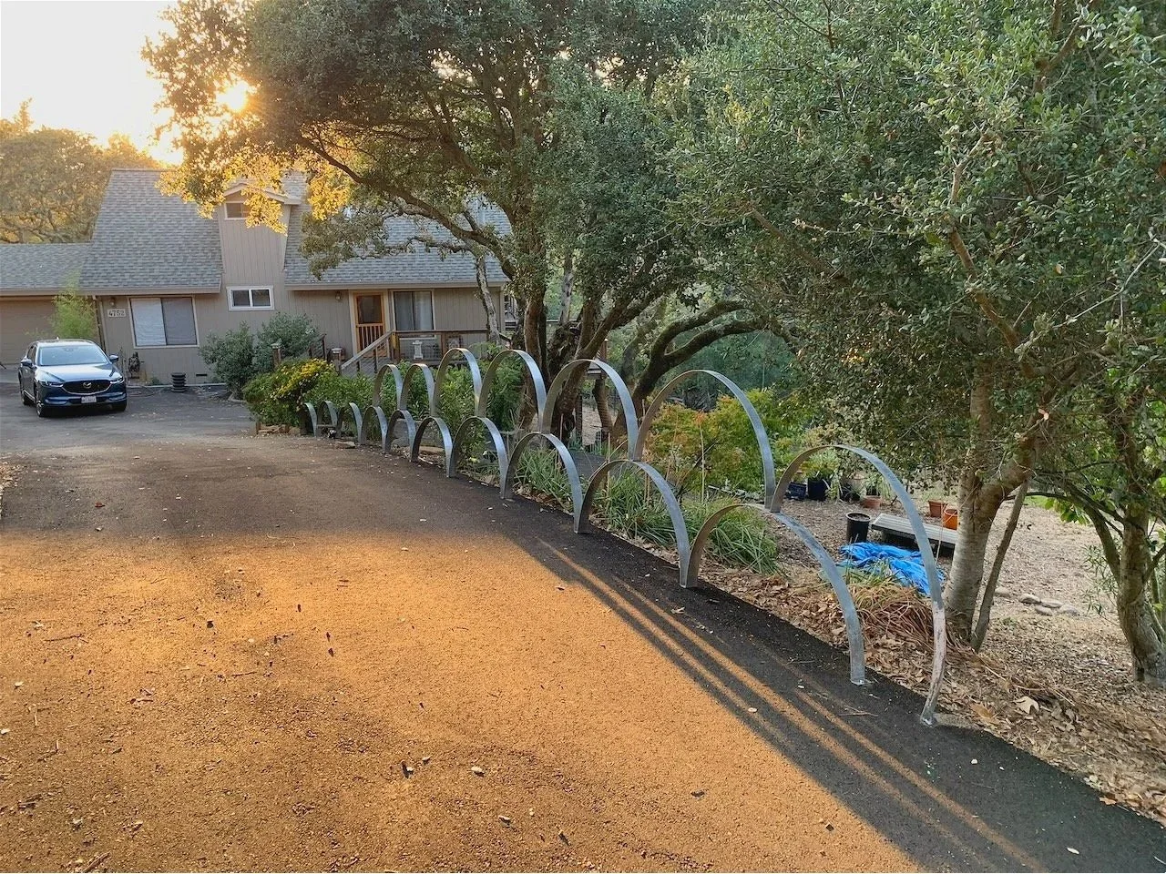 I saw these flanged semi-circles of galvanized steel, 2-3" wide and of varying diameters (32 - 46").  I bought them (by weight) for no then-known purpose..