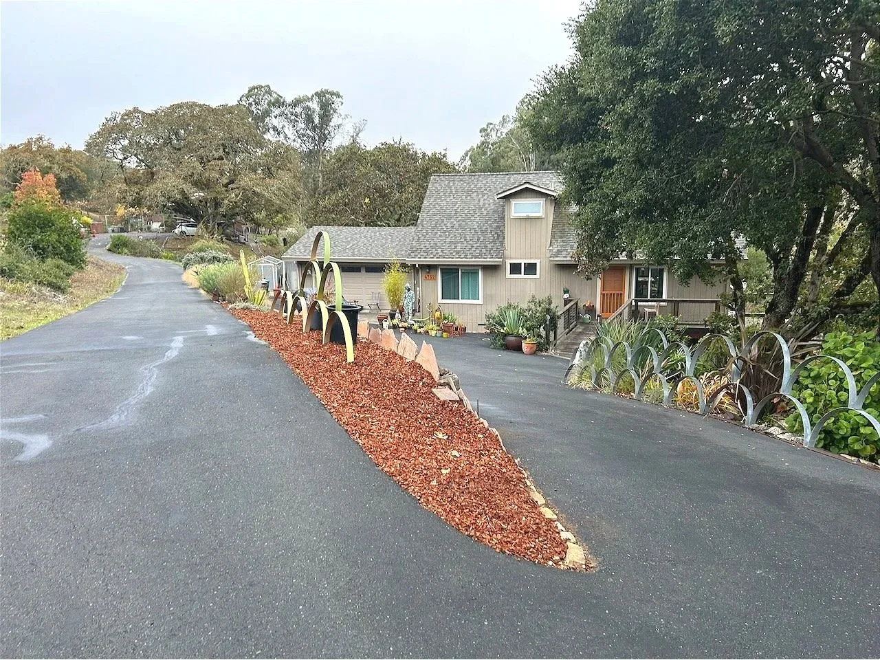 And so, the weed barrier, covered with mulch, now part of the sculpture installed...