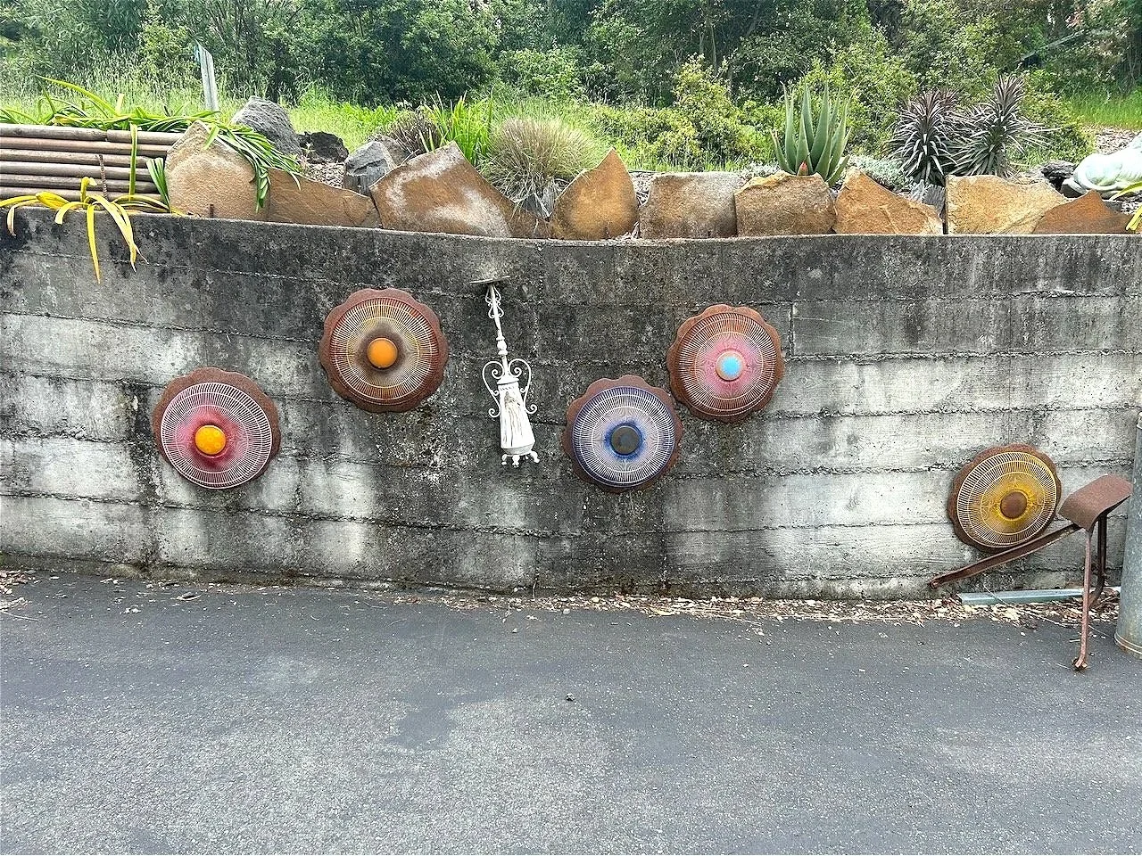 Salvaged disc plow pieces, disposed of fan guards, spray paint...