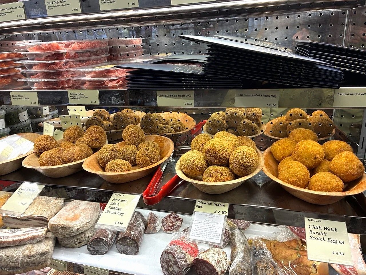 ...Mellis Cheese Shop, offering more than cheese. Here Scotch eggs, eggs, wrapped with sausage (these with upscale options), breadcrumbs and deep-fried