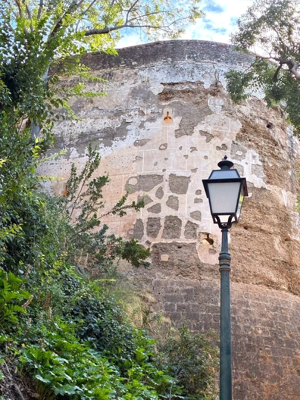 ...the photo shows the many-times-repaired wall, but I shot it hoping to learn about the yellow stuff in the crevice (still unsure)