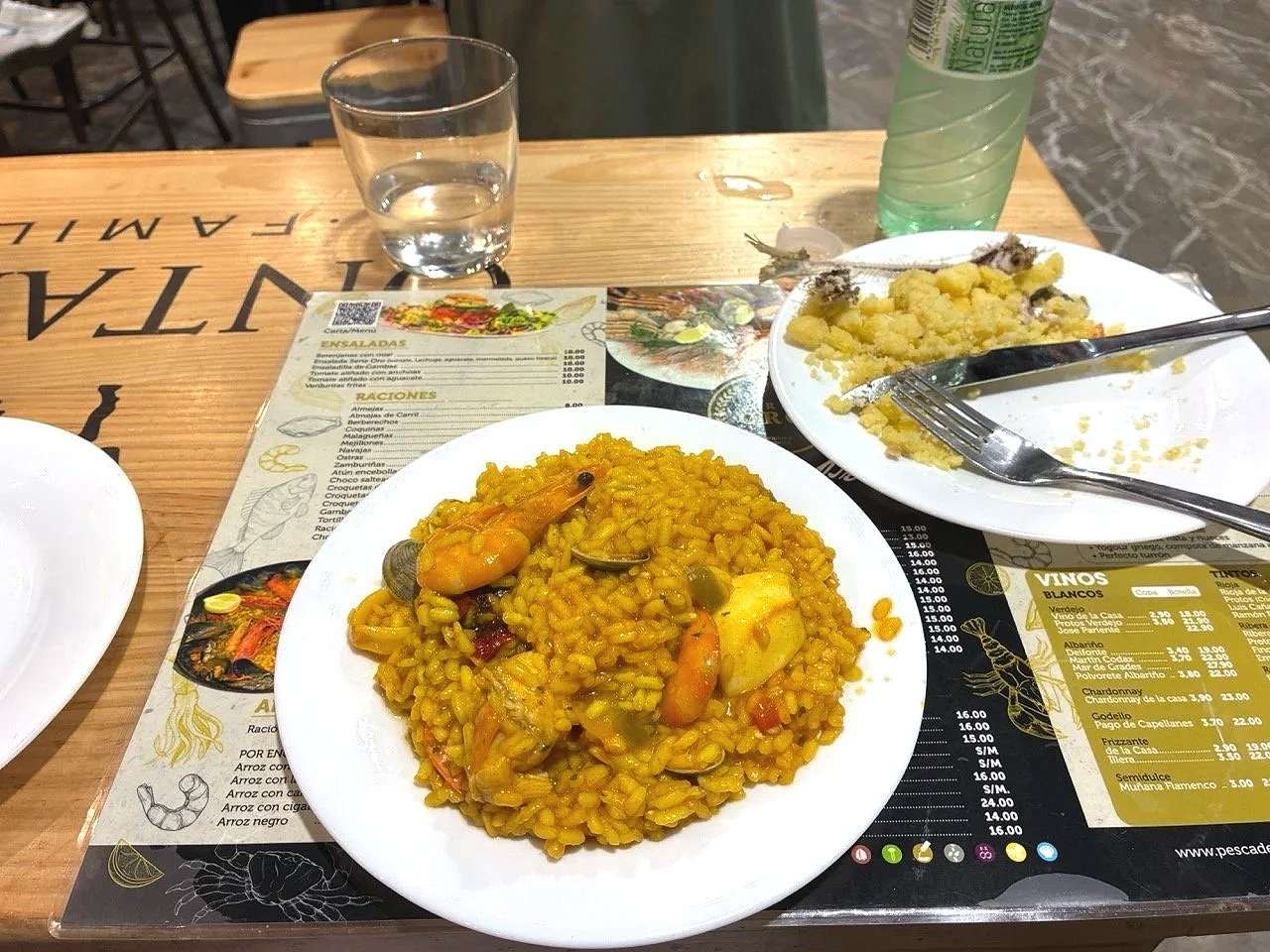 ...fried sardine w migas (bread/semolina moistened, pan-fried w garlic and pimentón til golden and crispy), this: not crispy or seasoned, but the sardine was good;  I ordered arroz mariscos, nice!