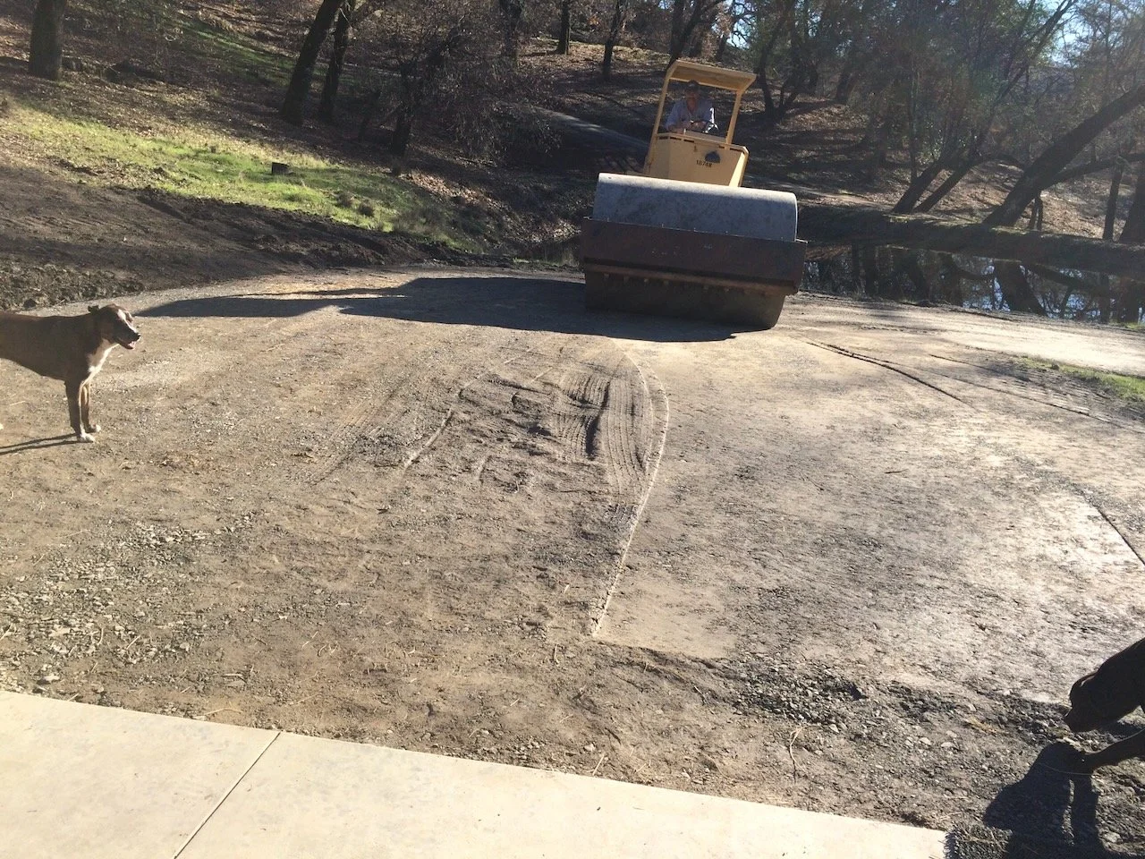 Road base, rolling, over the pipes...
