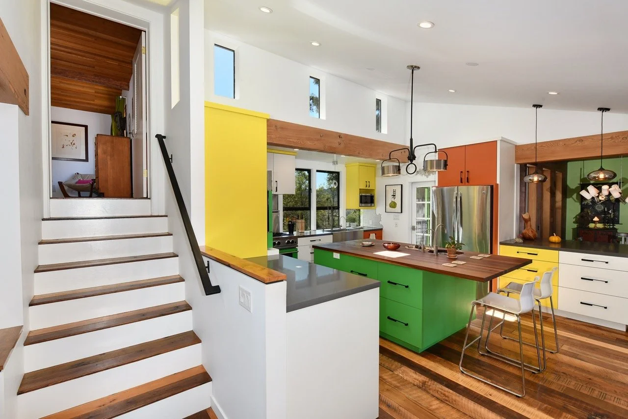 Up to bedroom, kitchen - I love those laminated cabinet colors...