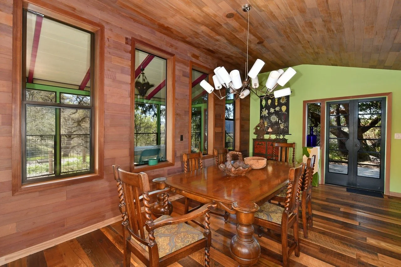 Dining, toward those doors, screened-in porch through the windows...