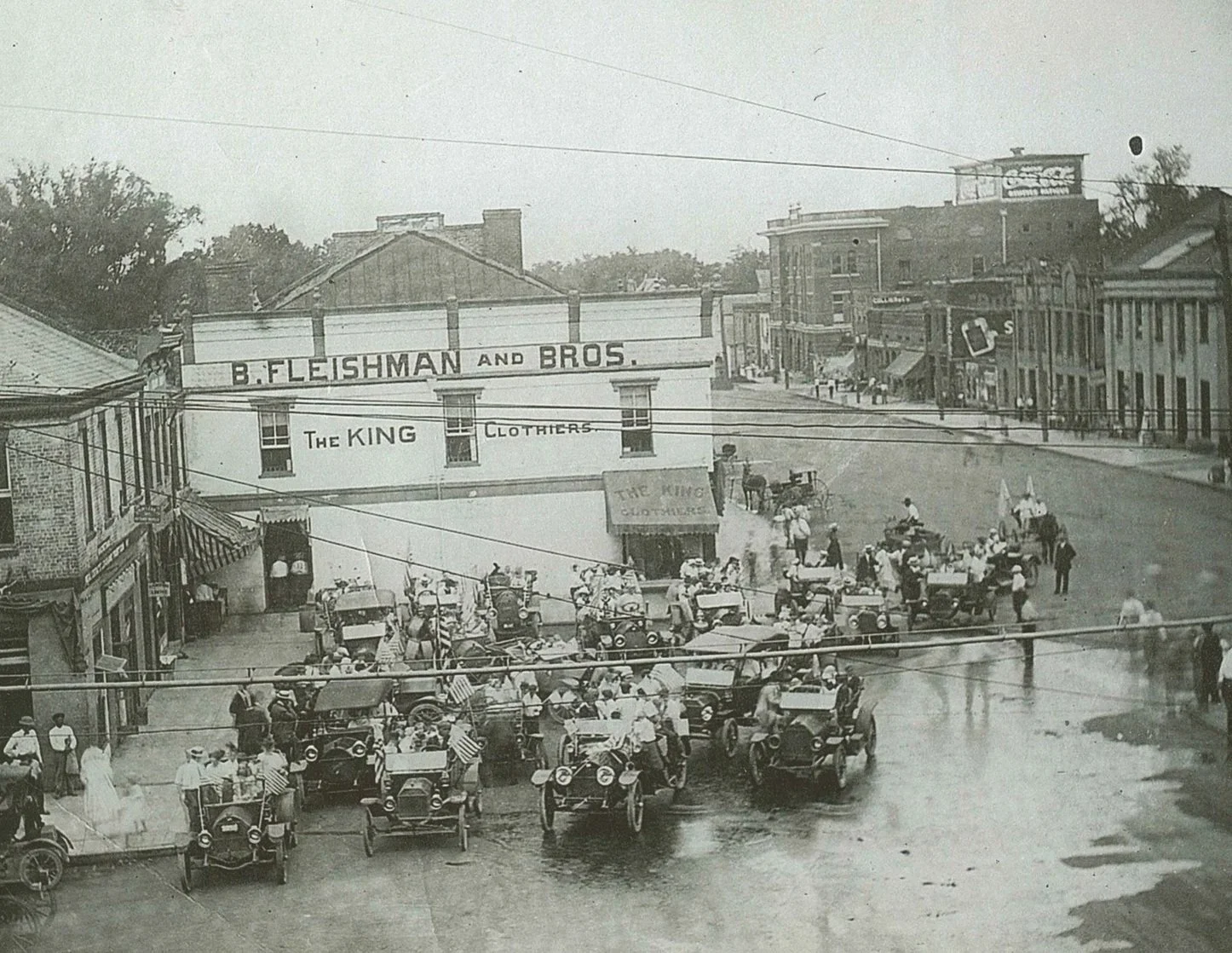 Fleishman and Bros. Store located in Fayetteville, NC with a car rally out front. Black and white picture.