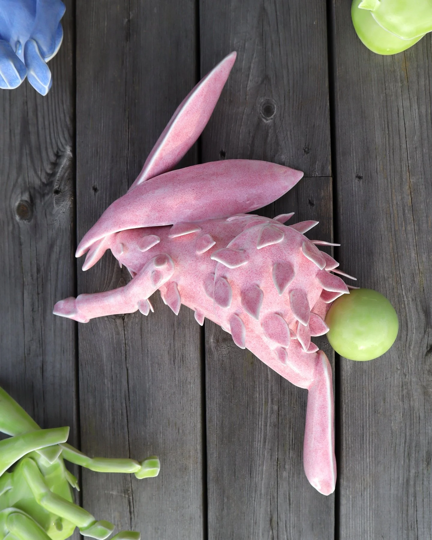 The hares jump between reality and the imaginary. They invite us to see magic every day.

They live on an island in the archipelago and eat carrots in peoples gardens. And they are made in porcelain, glazed in happy colours and easily hung on a wall.