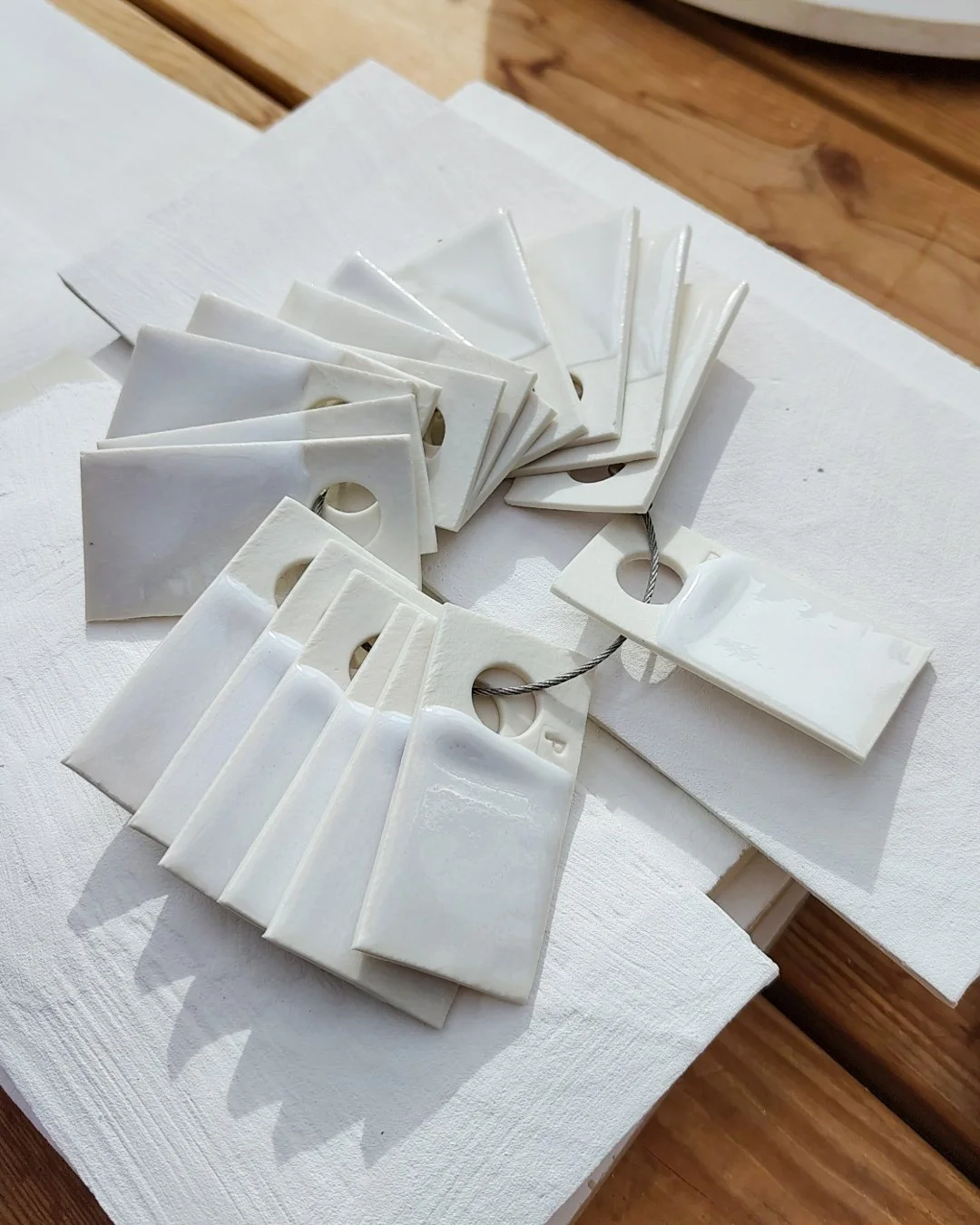 I'm intrigued by a group of white glazes doing a similar job as a colourful rainbow. The working name is "interesting whites" ...I must come up with a better name for the band. Suggestions? 
Anyhow, here are some tests. I looove the creamy 