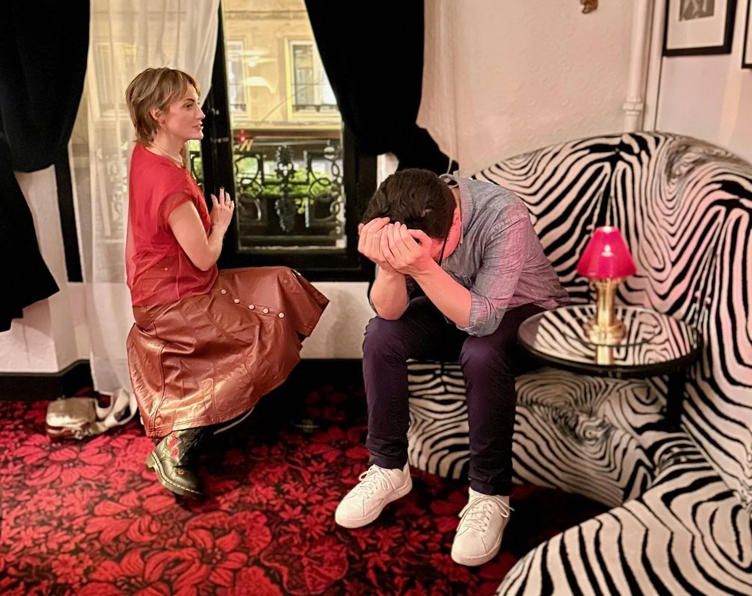This is a picture of my friend Isaac and me. We're in Paris for work. We're in a restaurant and he wanted me to leave this private upper room that I’d lead him to that we weren't supposed to be in. I thought it would make a cool photo, even if we got in trouble. The photo is cool. And we didn't get in trouble. I’m proud to be 50 now and still wearing fancy combat boots while breaking very minor rules.