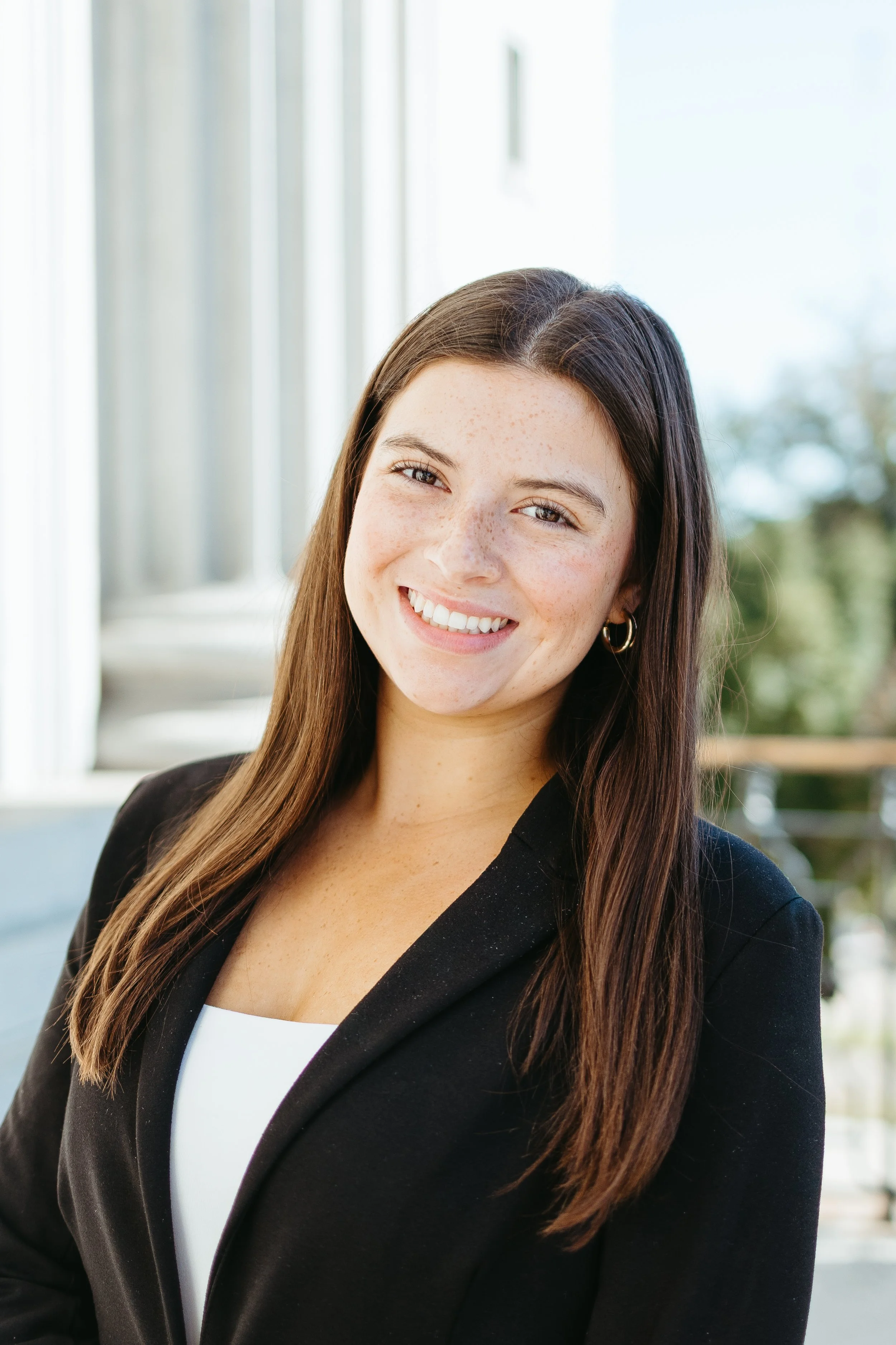 headshot of Carsen Malloy, hispanic white female with brown hair and brown eyes