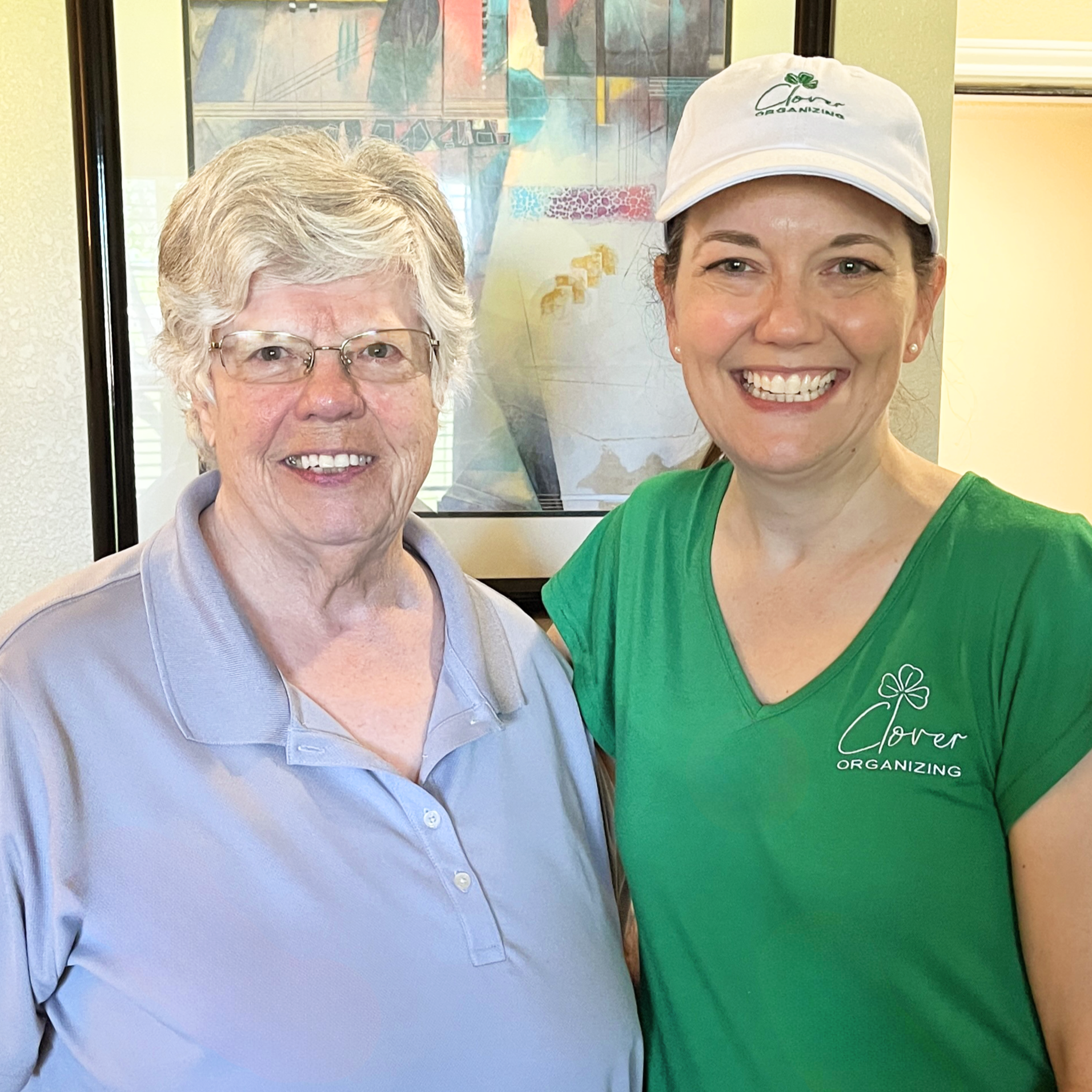 Organizers standing with female senior citizen