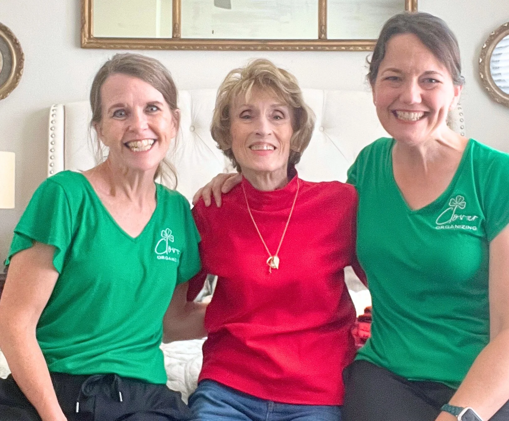 Three ladies sitting next to each other