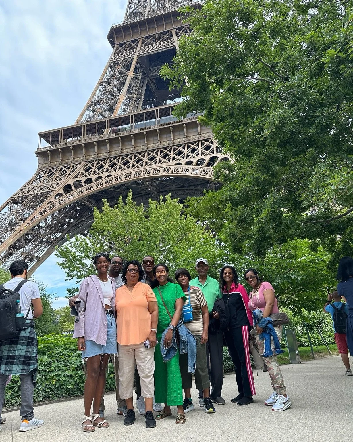 Gorgeous Global family travelers at the Eiffel Tower in Paris.