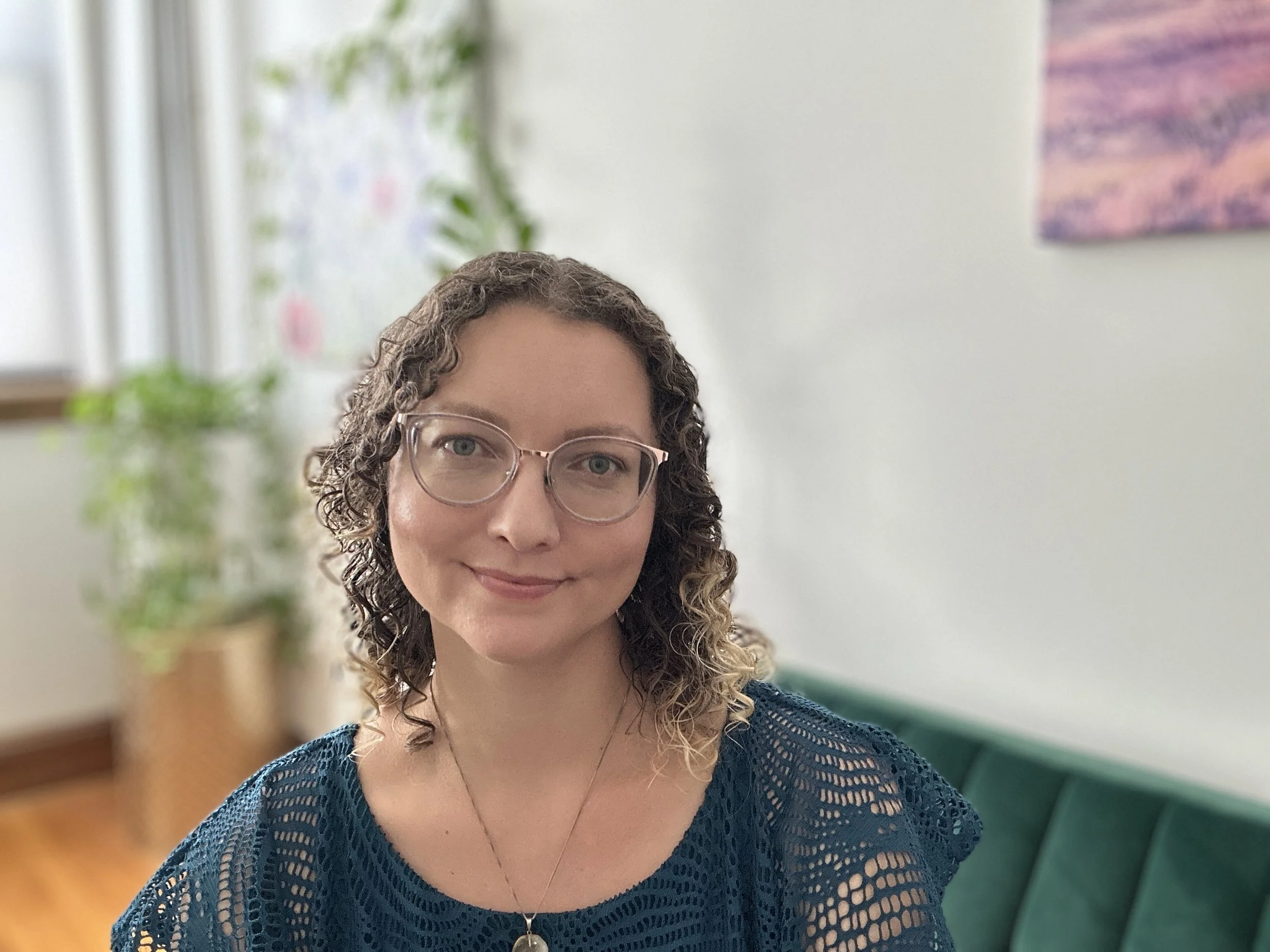 Alice Rizzi in a blue dress in her office
