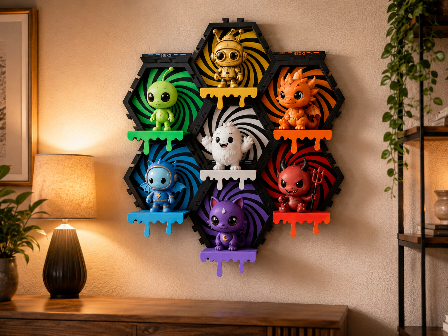 Wall display of eight colorful, cartoonish dragon and monster figures with spiral backgrounds, arranged in a hexagonal pattern, on a beige wall in a living room with a lamp and plant nearby.