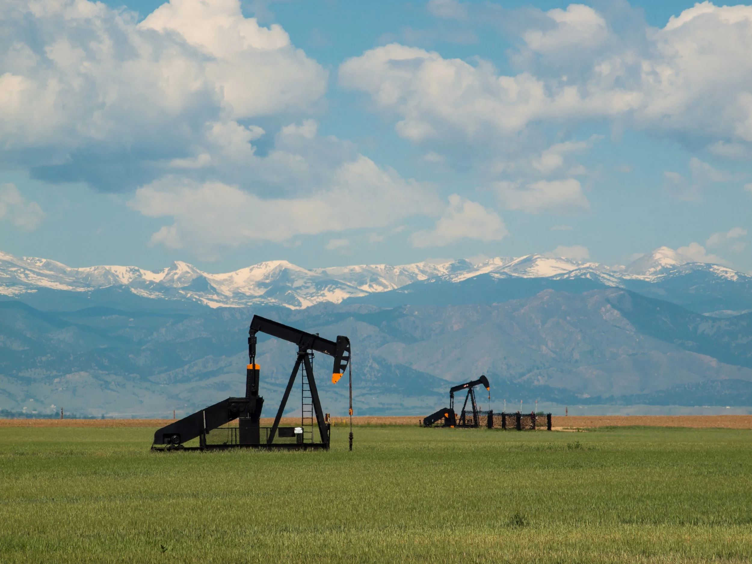 Oil pumpjacks representing Hallux Energy’s enzyme-based production enhancement and recovery technologies.