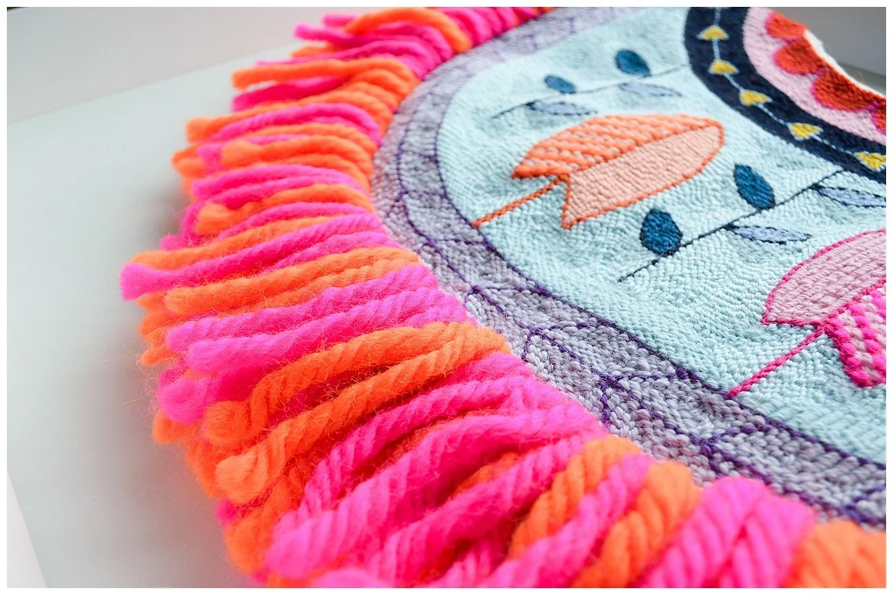 Modern interpretation of Niuean hiapo using tufted wool in a bright abstract design.