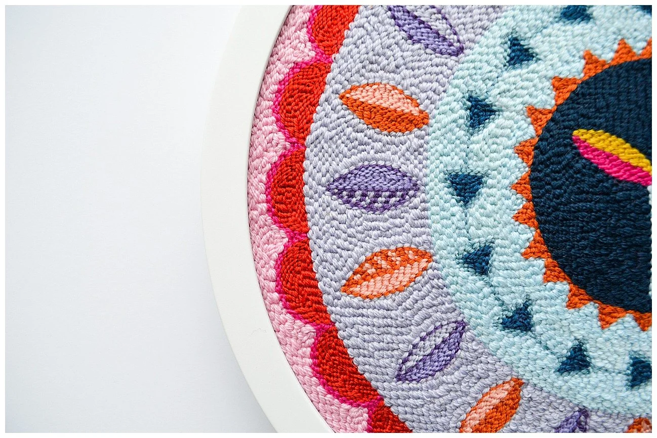 Modern interpretation of Niuean hiapo using tufted wool in a bright abstract design.