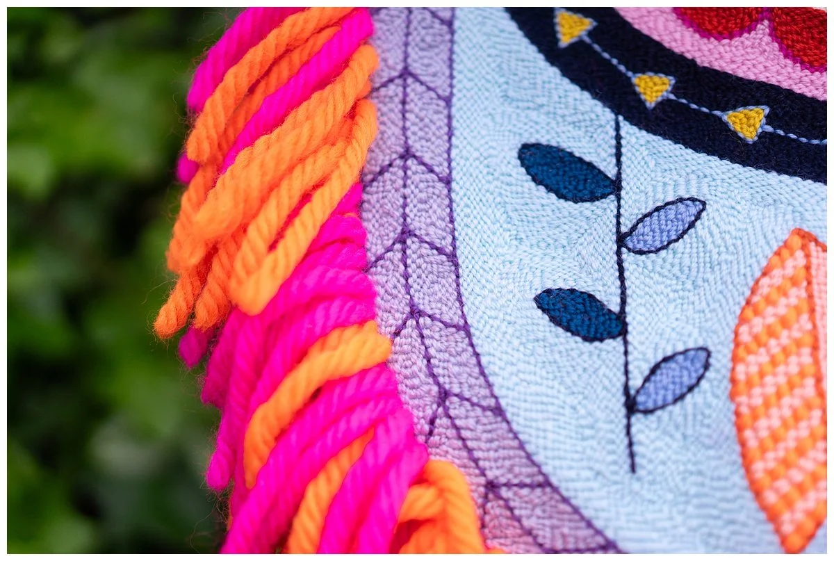 Modern interpretation of Niuean hiapo using tufted wool in a bright abstract design.