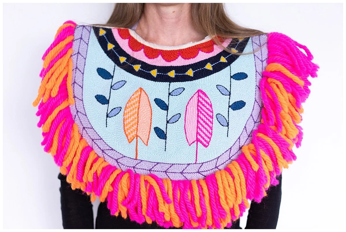 Punch needle textile artwork featuring contemporary Niuean hiapo-inspired motifs in colourful New Zealand wool.