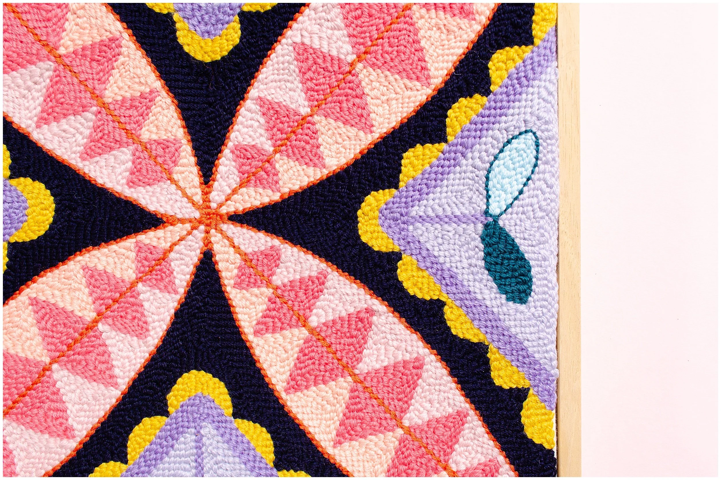 Punch needle textile artwork featuring contemporary Niuean hiapo-inspired motifs in colourful New Zealand wool.