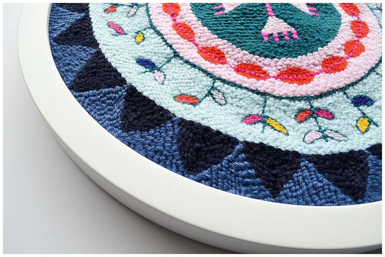 Modern interpretation of Niuean hiapo using tufted wool in a bright abstract design.