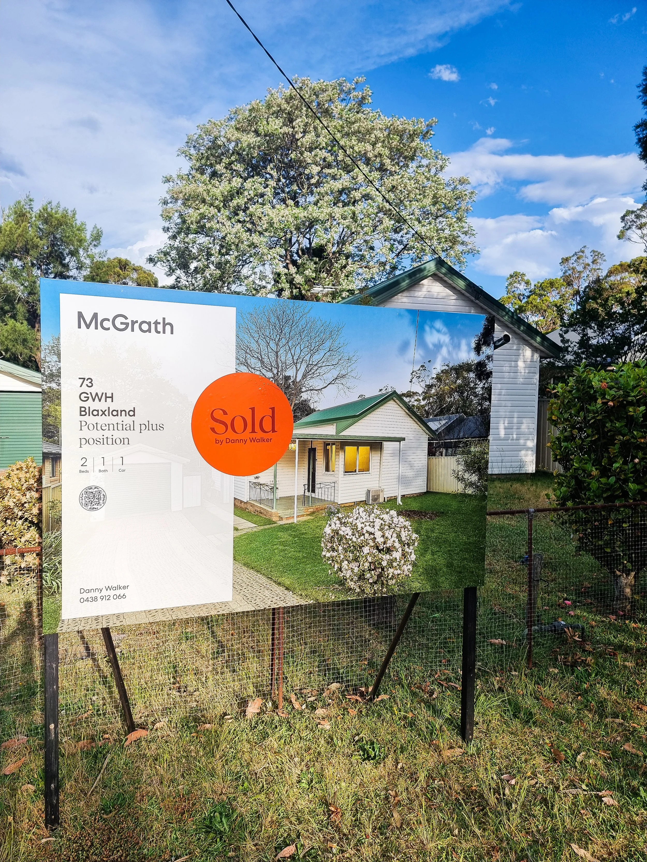 Sold sign outside a Blaxland home under clear blue skies — another successful result by Danny Walker Real Estate.