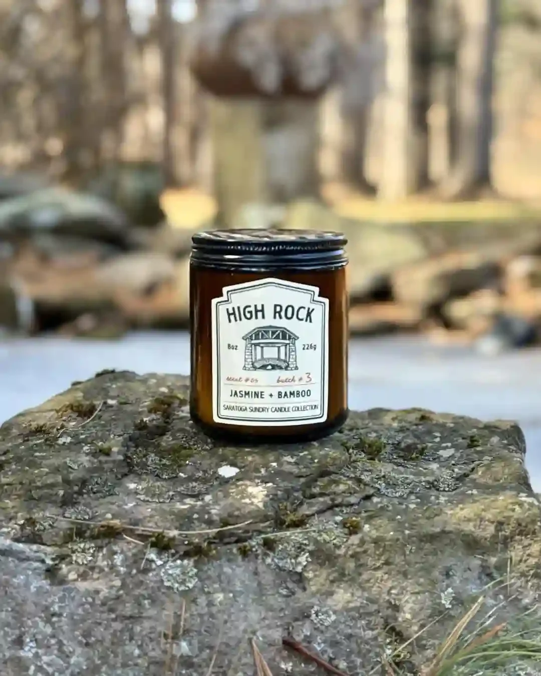 High Rock Saratoga Sundry candle on a rock.webp