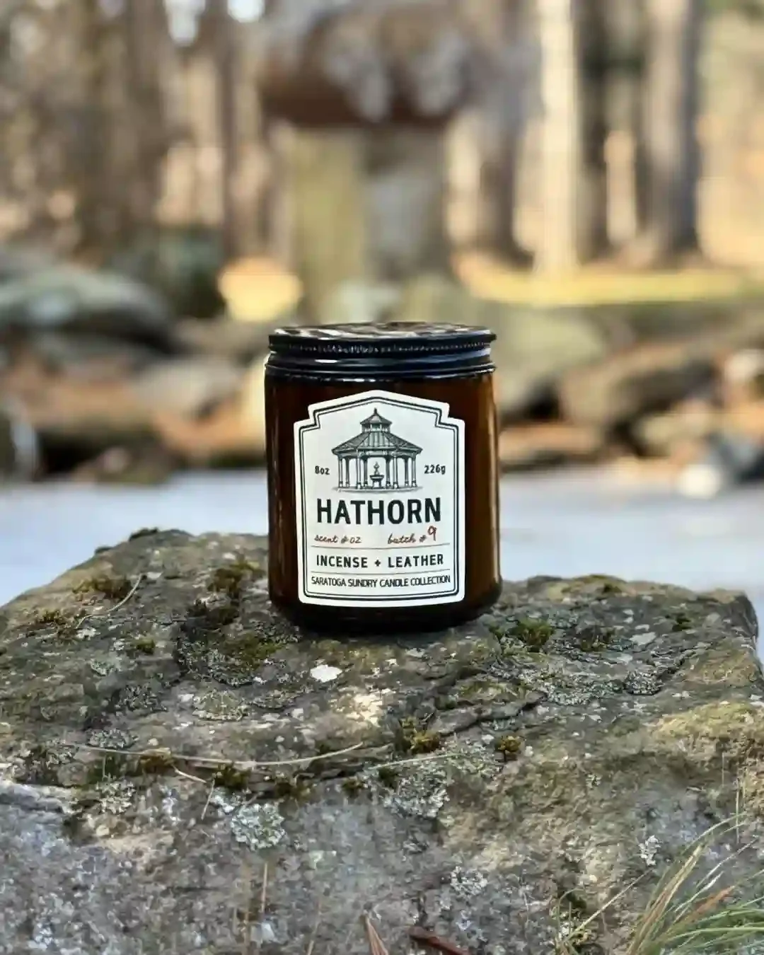 Hathorn Saratoga Sundry candle on a rock.webp