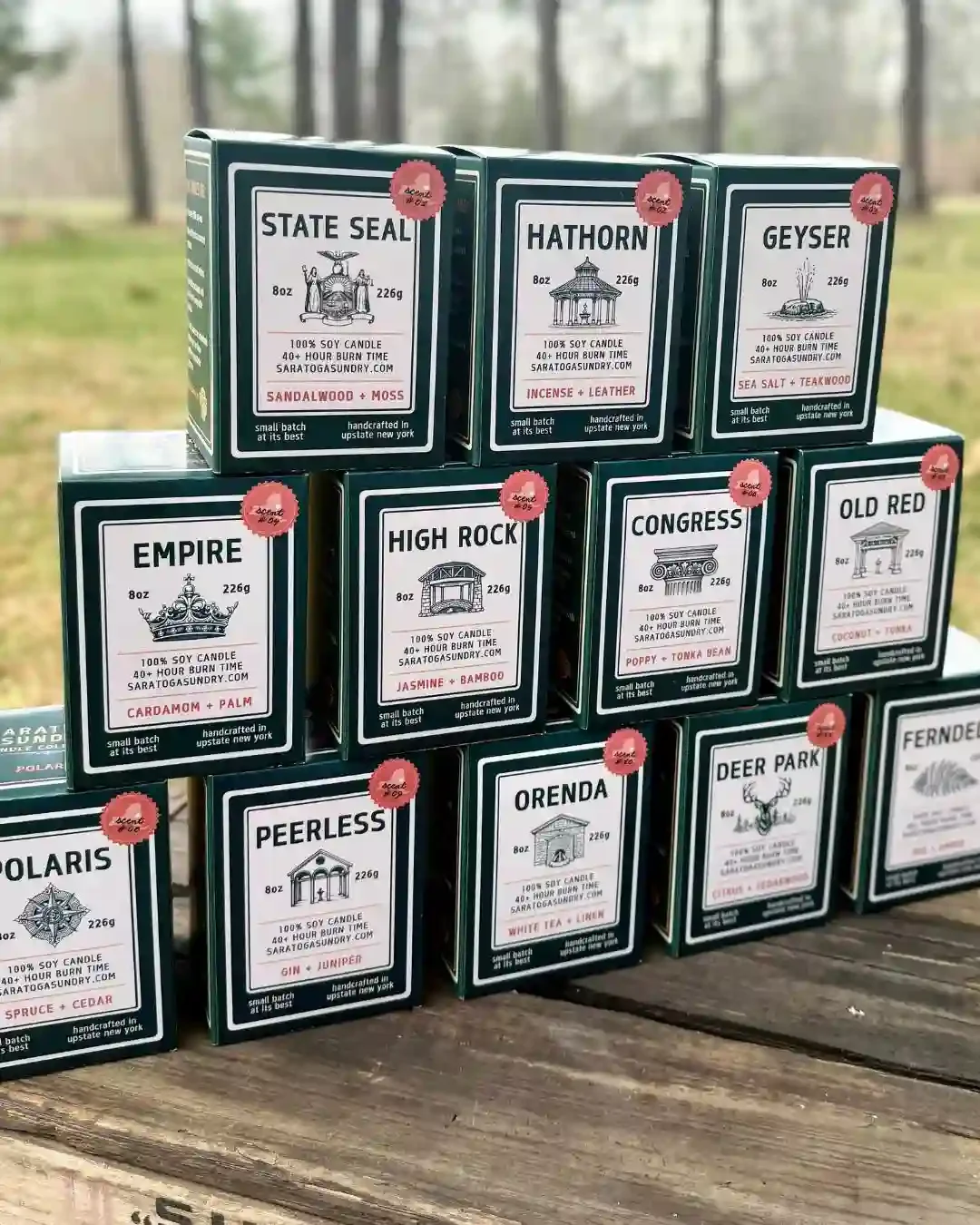 Collection of Saratoga Sundry candles in their gift boxes.webp