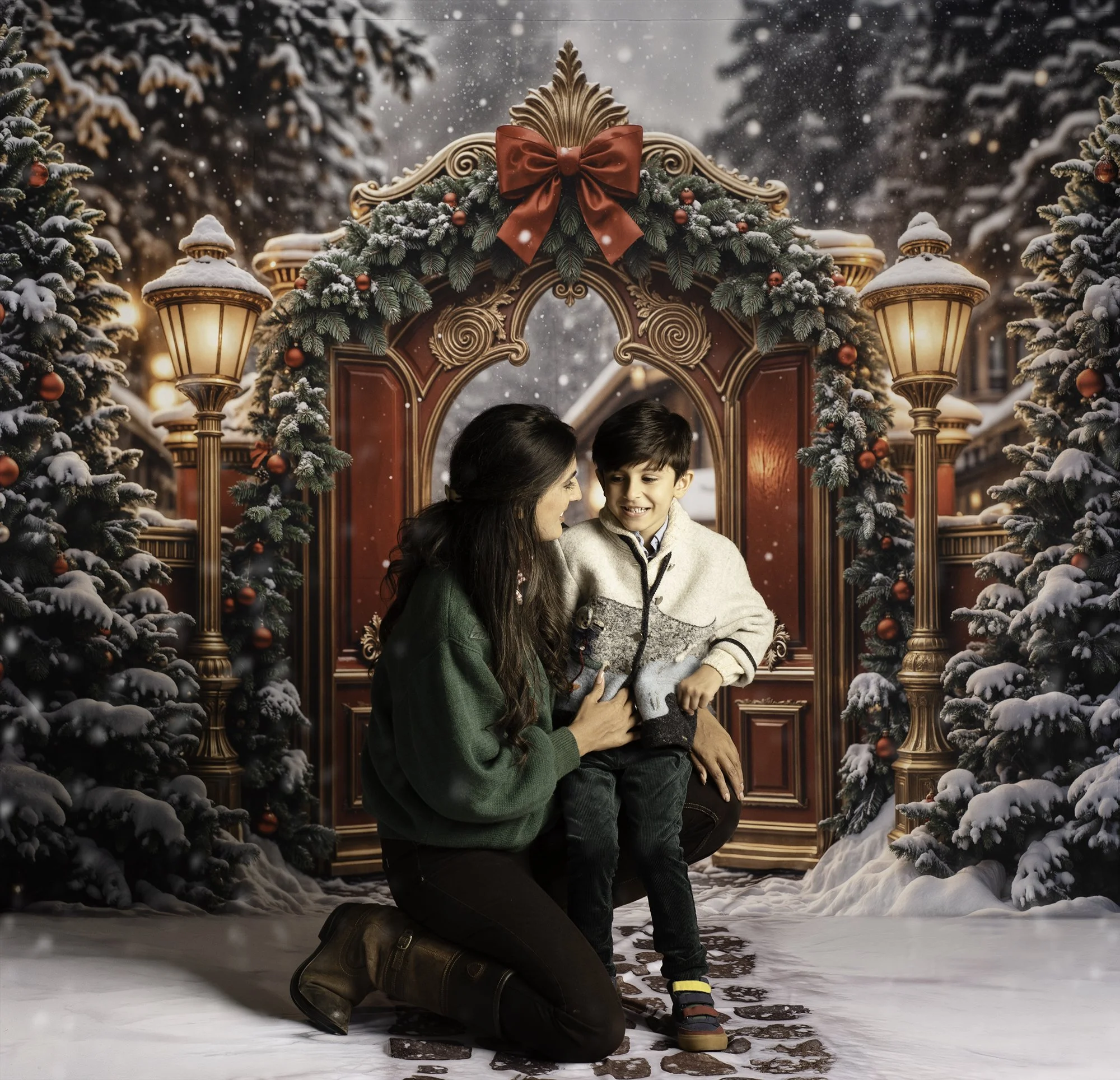 mother and son posing infant of Santa's workshop entrance