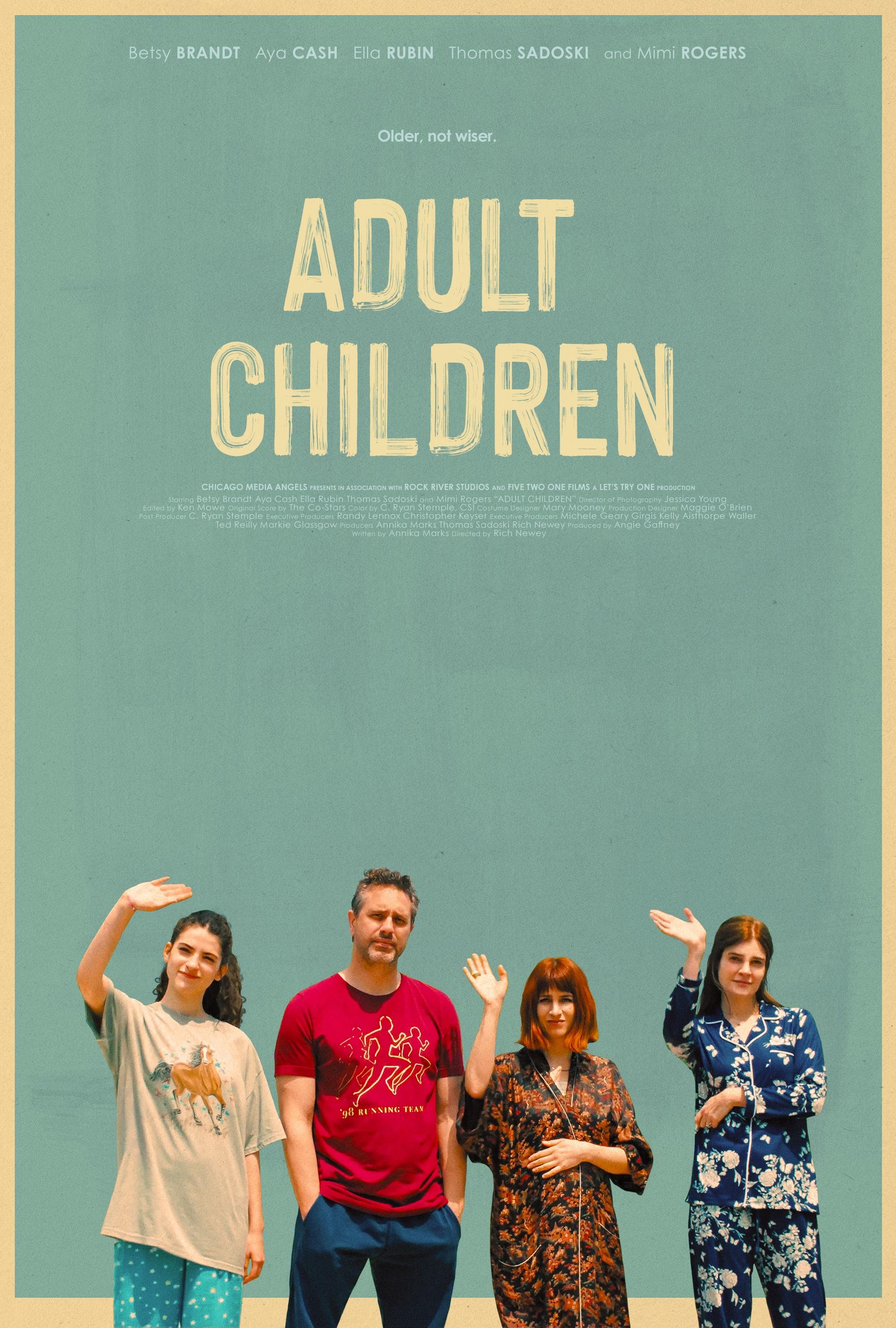 Four people standing against a teal background with text at the top. They are waving and dressed casually.