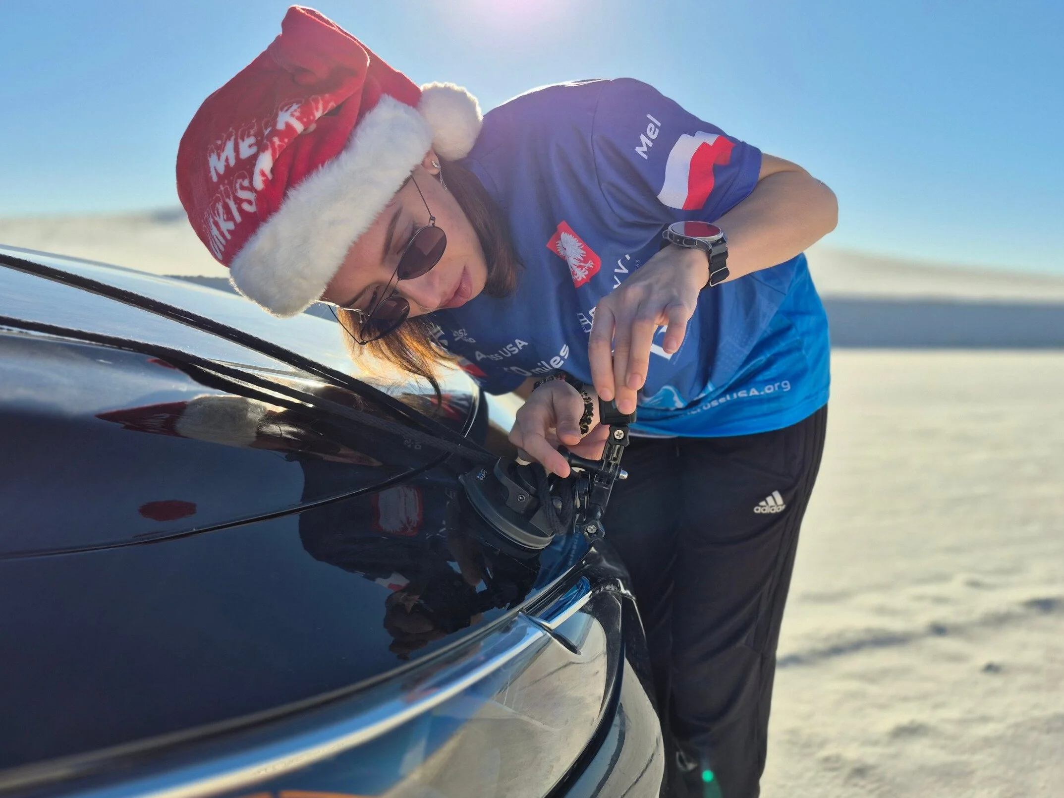 White Sand New Mexico Melissa setting up Gopro wearing a santa hat