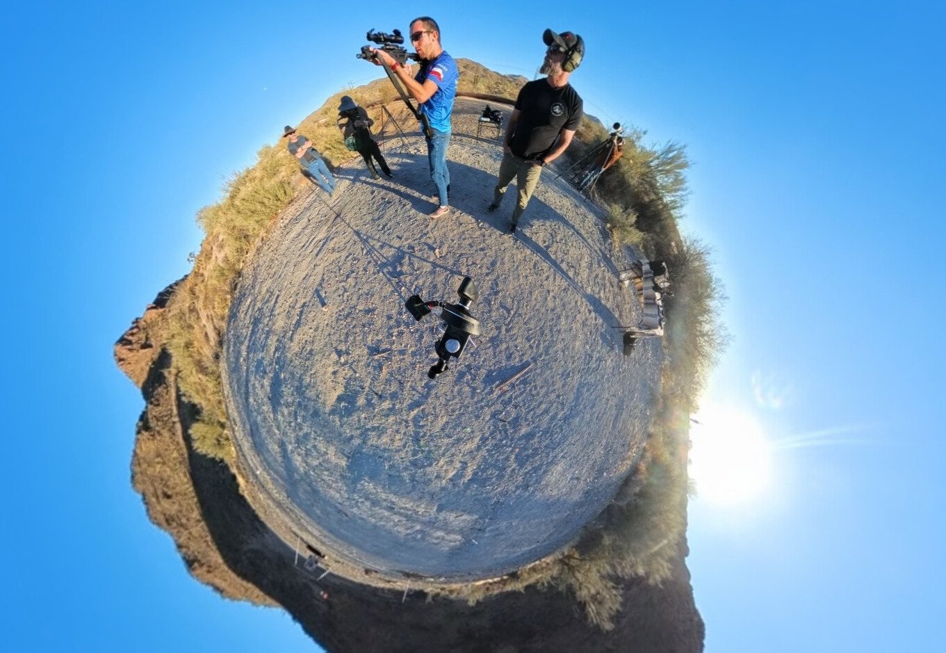 Arizona Tomasz and Navy Seal from an Insta 360 camera, shooting guns into the mountains.