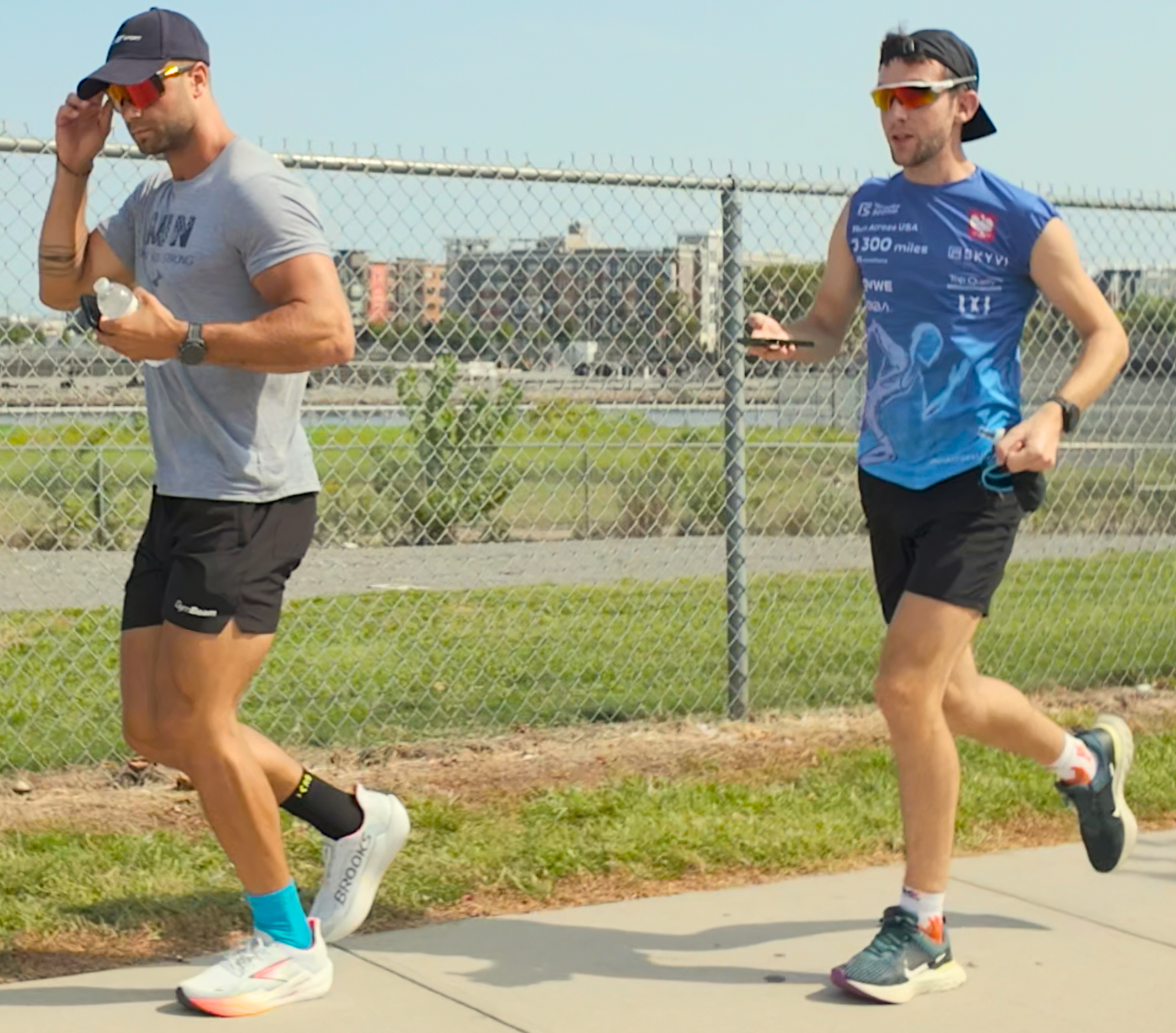 New Jersey Tomasz and Lukas running together on the sidewalk