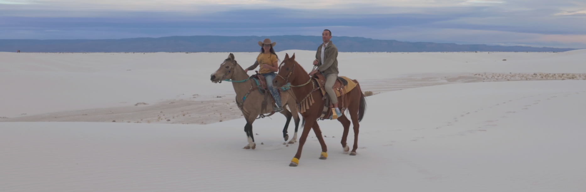 White Sands New Mexico Tomasz riding horses with Sondra