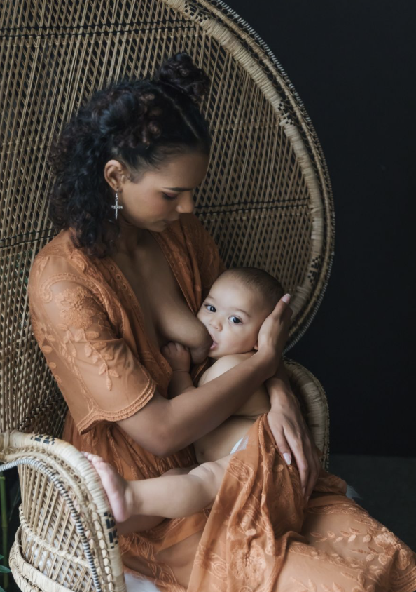 Women breastfeeding her baby during postpartum